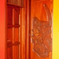 (Left) 6 panel door with dowel venting. Dinosaur skeleton carving. Mahogany, light walnut stain