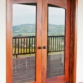Full glass panel arch top mahogany french door