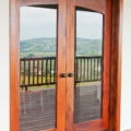 Full glass panel arch top mahogany french door