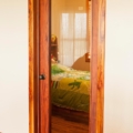 Full glass panel eyebrow arch passage door, figured mahogany