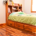 Granadillo child bed with storage drawers