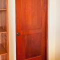 Custom two panel door with trimless frame, mahogany