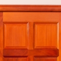 Standard six panel walk-through door, natural finish, figured mahogany